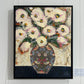 GEORGINA BARNETT White roses in a decorative vase