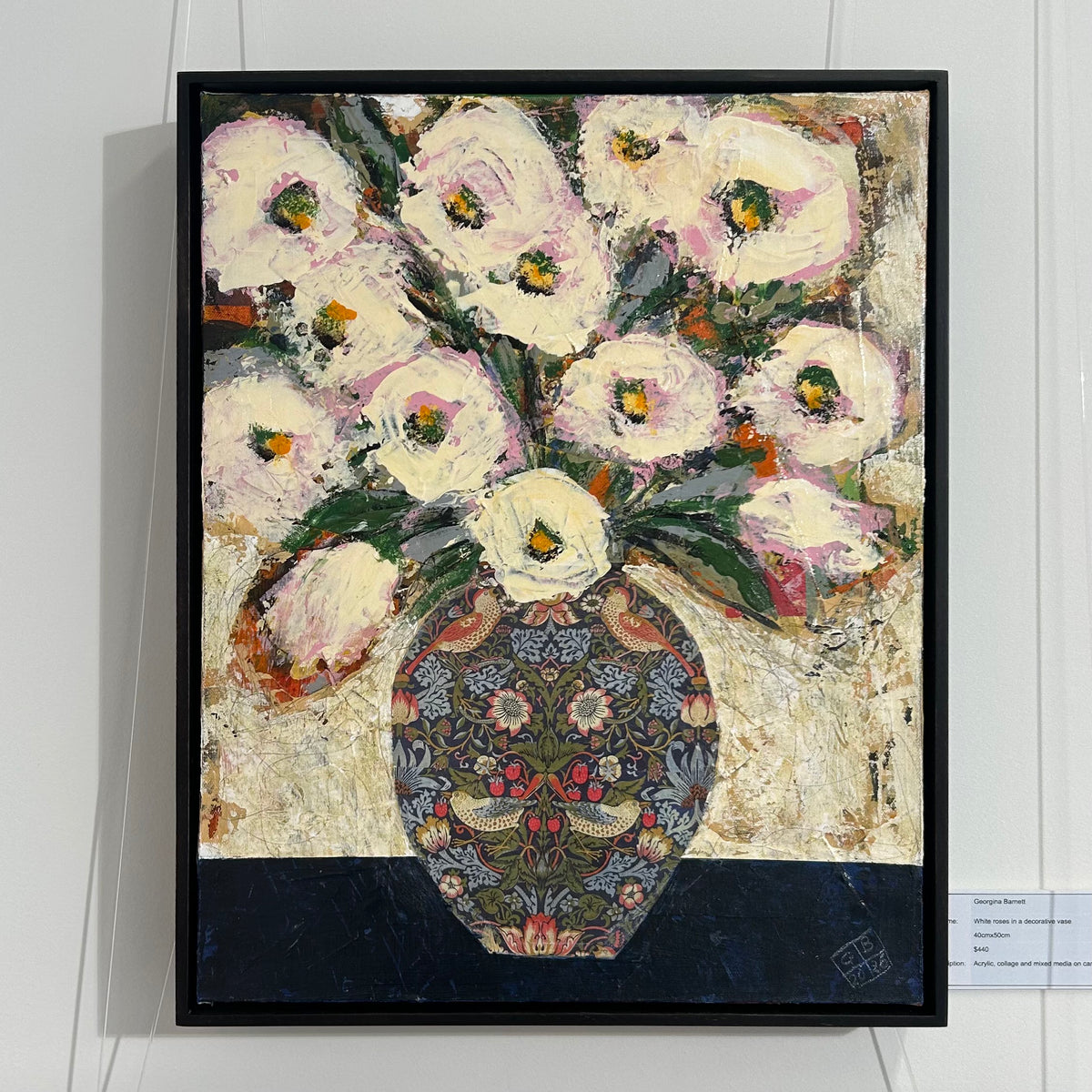 GEORGINA BARNETT White roses in a decorative vase