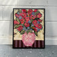 GEORGINA BARNETT Red roses in a decorative pink vase