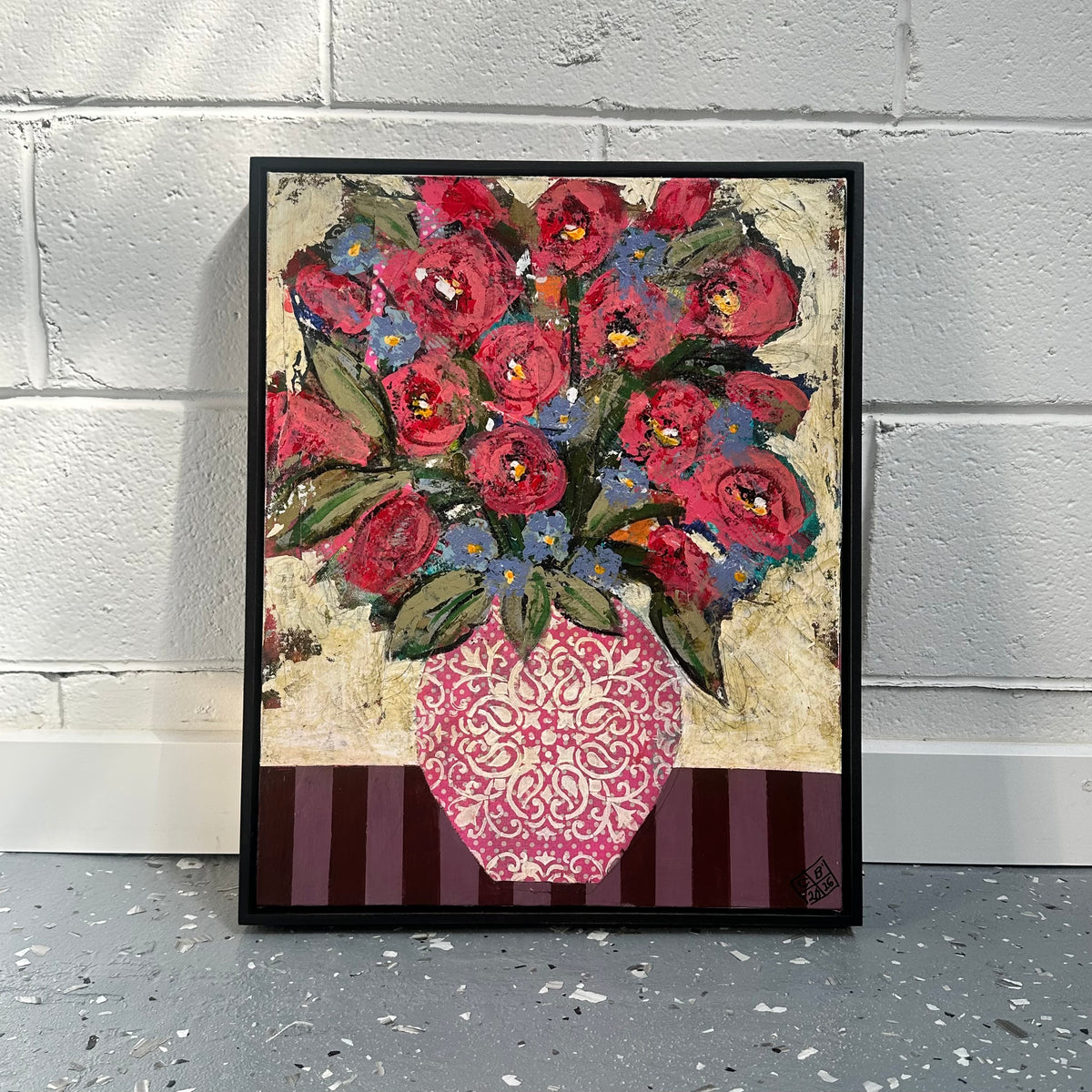 GEORGINA BARNETT Red roses in a decorative pink vase